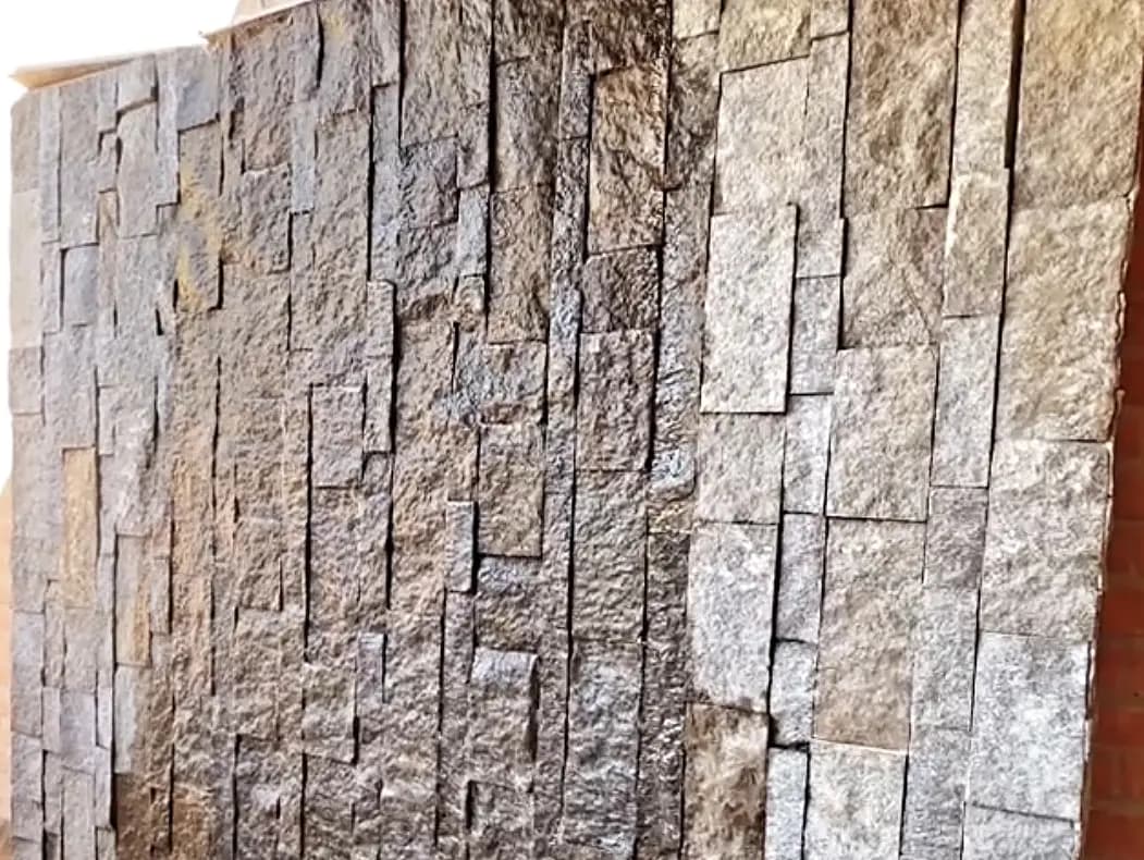 Finished stacked stone veneer feature wall built by AYJ Construction in Tucson